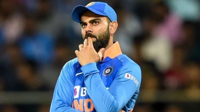 Virat Kohli smiling during a public event – representing his success and net worth in 2025.
