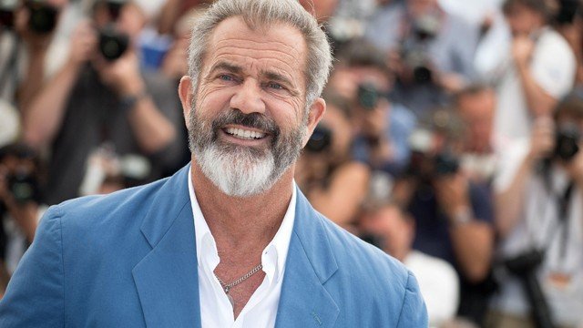 Mel Gibson smiling at a red carpet event – Hollywood actor and director worth $425 million in 2025.