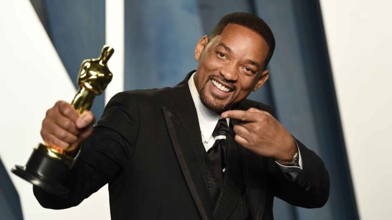 Will Smith smiling in a suit at a red carpet event – Will Smith Net Worth 2025